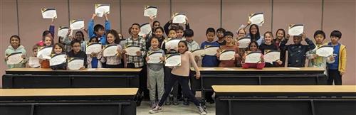 This picture shows the students holding their NSTEM certificates.